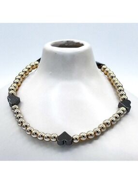 Gold beads with black hearts bracelet.